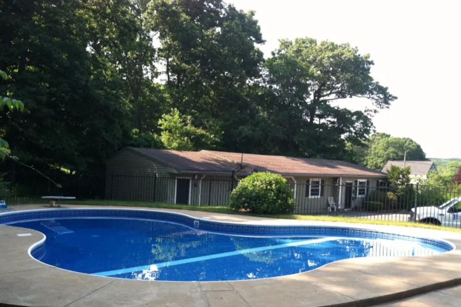 Finished kidney-shaped in-ground pool
